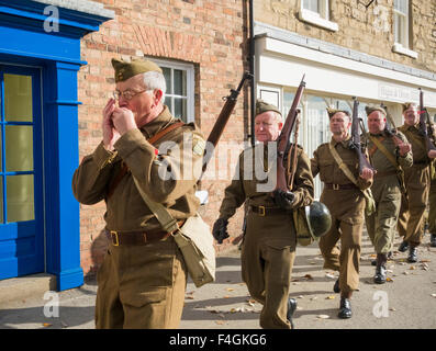 Pickering, North Yorkshire, UK. 17th October, 2015. Pickering`s annual Wartime and 40`s Weekend attracts thousands, with World War 2 living history camps and battle re-enactments amomg the attractions. PICTURED: Home Guard marching through the town Stock Photo